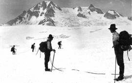 "Mountaineers hiking through snow, 1910"
