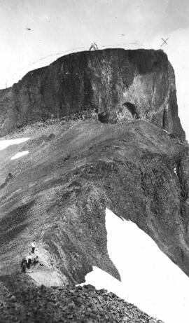 "The Black Tusk.  Garibaldi:  Holly and I [Nellie Chapman] climbed part way up this chimney and through the shale which slid from us... rather exciting.  Snow in side slope of moving glacier. 1910"